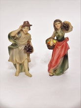Two of the 15 Nativity Scene hand-painted figurines. Female and male 4" peasant figurines.
