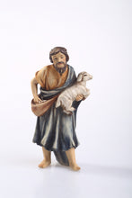 Nativity Scene Shepard with a lamb, one of the 15 Nativity Scene figurines. 4" tall, hand-painted polyresin.