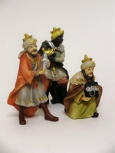 Three of the 15 hand-painted figurines included in the Nativity Scene. Three Kings Bearing Gifts. Polyresin Christmas Nativity Scene figurines, up to 4" tall. 