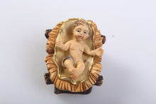 Baby Jesus figurine, part of the  Nativity Scene. Baby Jesus is removable from the bed